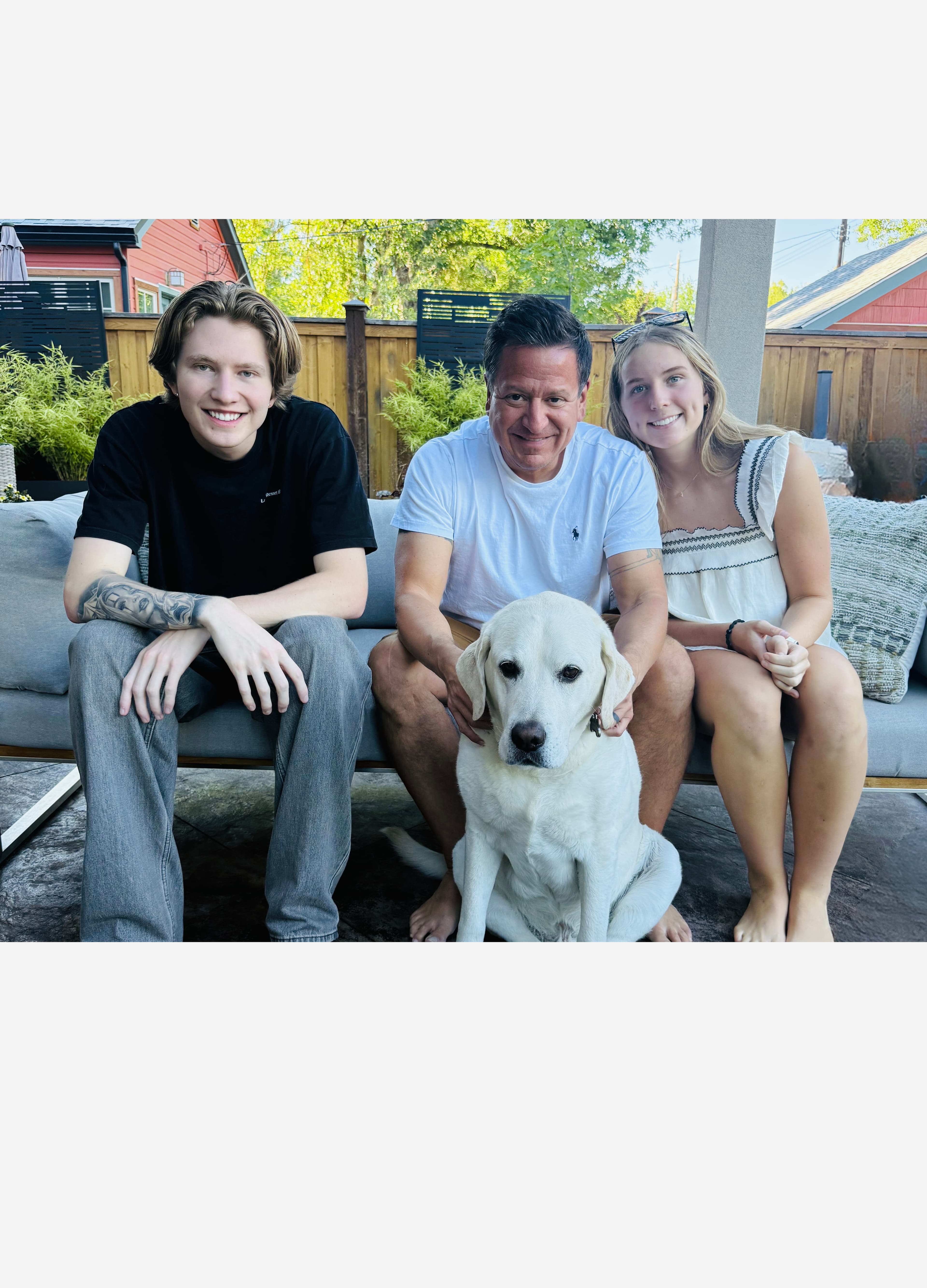 A father fully present with his two grown children and the family dog after retiring from alcohol
